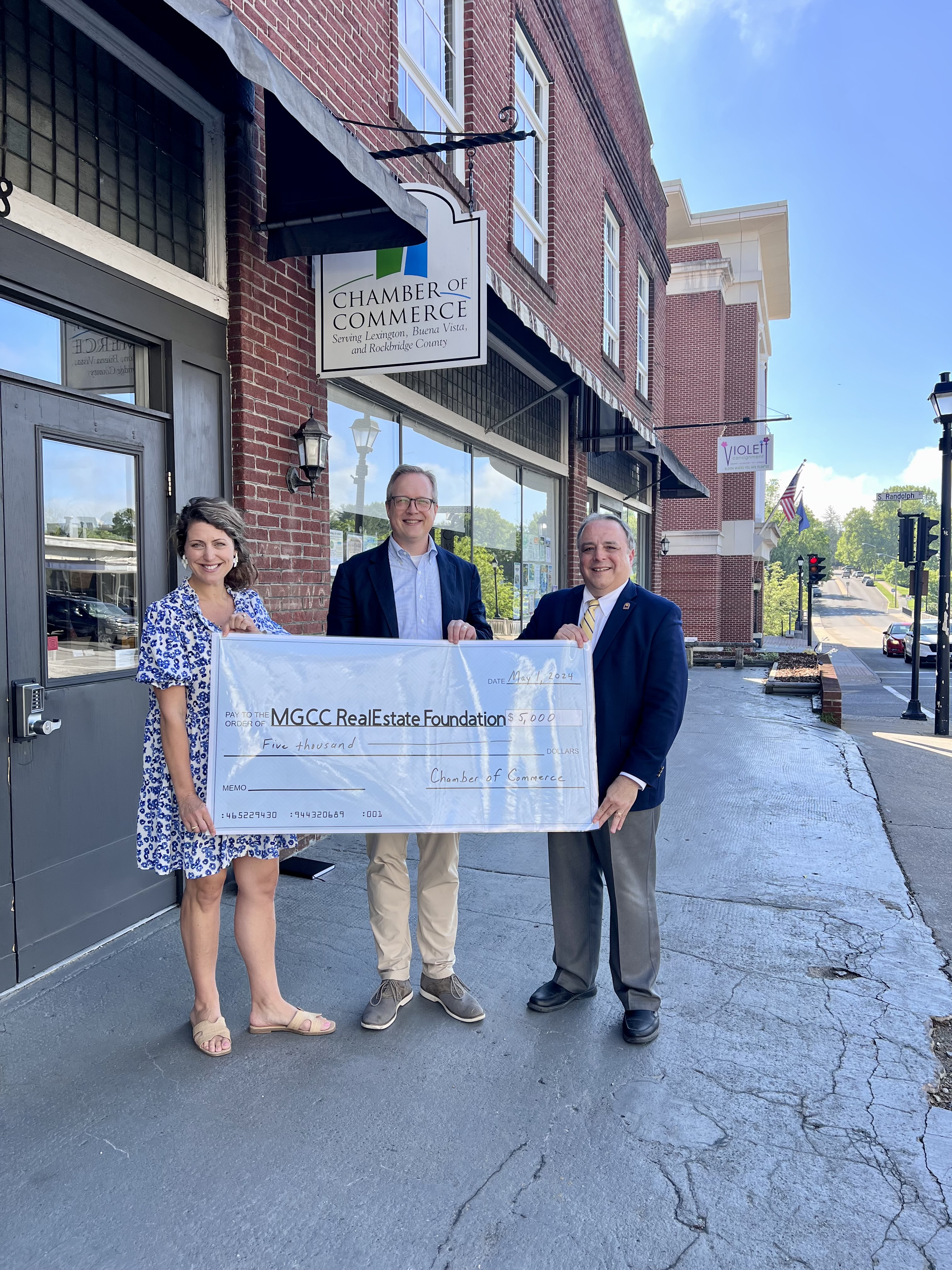 The Lexington-Rockbridge Chamber of Commerce Executive Director poses with MGCC President Dr. Rainone and VP of Academic Affairs Dr. Ben Worth during a check presetation