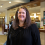 A headshot of Ashley Pratt in the MGCC Library. 